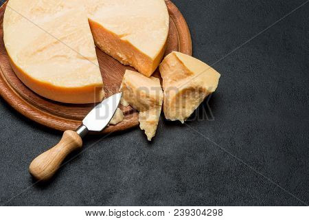 Whole Round Head And Pieces Of Parmesan Or Parmigiano Hard Cheese