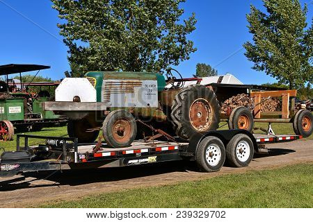 Dalton, Minnesota, Sept 8, 2017: An Old Oliver 70 Industrial Tractor  With A Front Powered Saw Blade