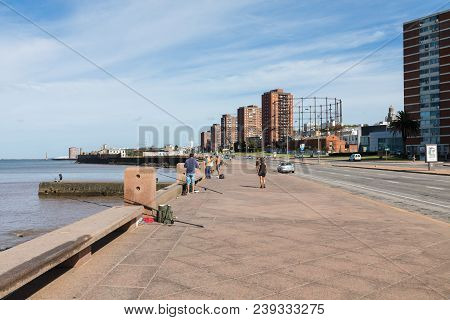 Montevideo, Uruguay - February 03, 2018: People Fishing At Boulevard In Montevideo, Uruguay. Montevi