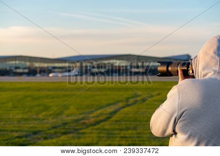 Gdansk, Poland - May 5, 2018: Plane Spotter Taking A Photo Of An Airplane Landing At Lech Walesa Air