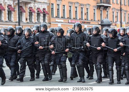 ST. PETERSBURG, RUSSIA - MAY 5, 2018: Police officers in riot gear block an Nevsky prospect during an opposition protest rally ahead of President Vladimir Putin's inauguration ceremony.
