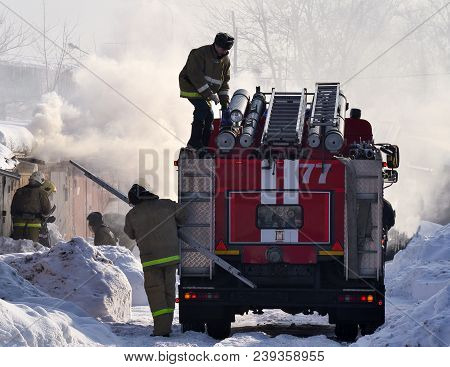 2018 February 22, A Fire Truck And Firemen Extinguish A Fire. Russia. Winter Season.
