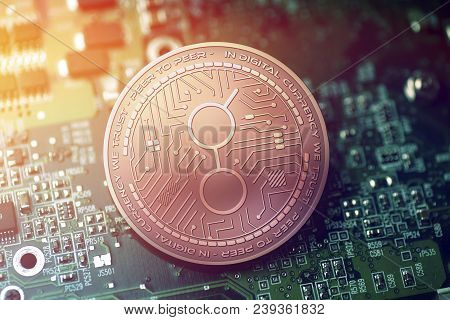 Shiny Copper Golem Cryptocurrency Coin On Blurry Motherboard Background Token