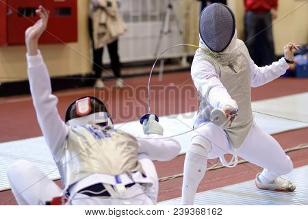 ST. PETERSBURG, RUSSIA - MAY 4, 2018: Ivan Troshin (left) vs Dmitry Komissarov, both of Russia, in first competition day of Fencing World Cup Saint-Petersburg Foil. The tournament is hold in 44th time