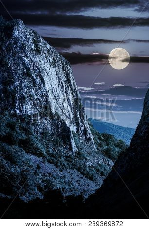 Cliffs Of Trascau Mountains Canyon At Night In Full Moon Light. Lovely Scenery Of Carpathian Landsca