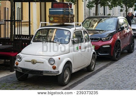 Budapest, Hungary - May 5, 2018: Veteran Fiat 500 Meets Modern Bmw I3. Technology And Tradition. The