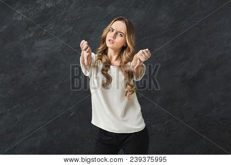 Woman Showing Thumbs Down Gesture, Dislike Sign. Young Emotional Girl Showing Negative Emotion, Symb