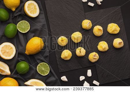 Slate Platters With Assortment Of Lemons And Limes On Black Background, Copy Space. Top View On Ripe