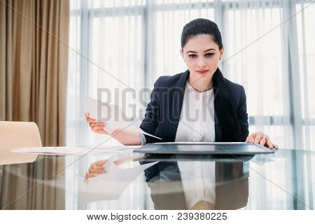 Business Lady At Work. Company Manager. Woman Looking Through Documents In Office. Professional Corp