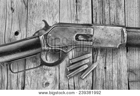 Antique 1876 Lever Action Cowboy Rifle In Black And White.