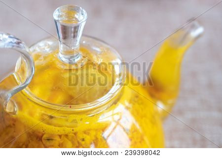 Close Up Teapot With Orange Buckthorn Tea Inside