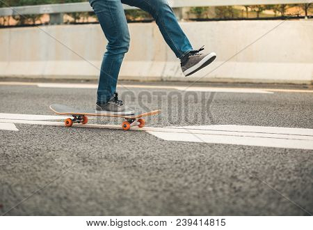 One Young Female  Skateboarder Sakteboarding On Highway