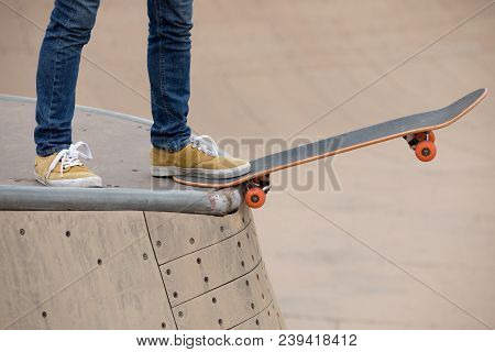 One Young Skateboarder Sakteboarding On Skatepark Ramp