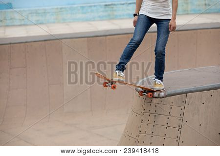 One Young Skateboarder Sakteboarding On Skatepark Ramp