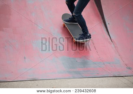 One Young Skateboarder Sakteboarding On Skatepark Ramp