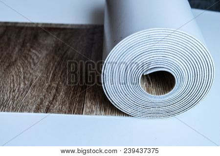 Roll Of Linoleum On A White Background