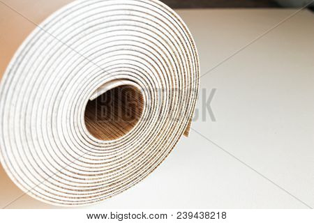Roll Of Linoleum On A White Background