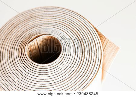 Roll Of Linoleum On A White Background