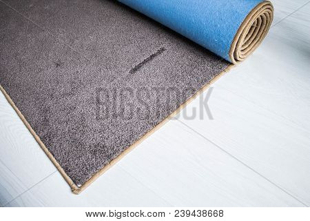 Home Floor Carpet With Overlock On White Laminate.
