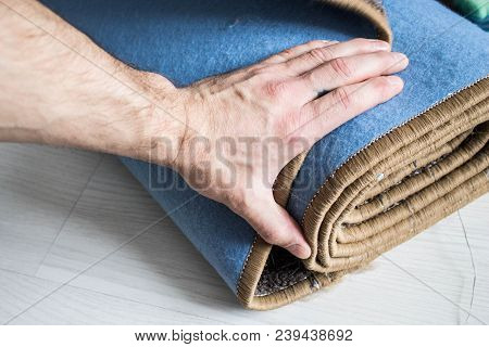 Home Floor Carpet With Overlock On White Laminate.