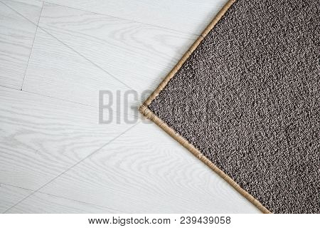 Home Floor Carpet With Overlock On White Laminate.