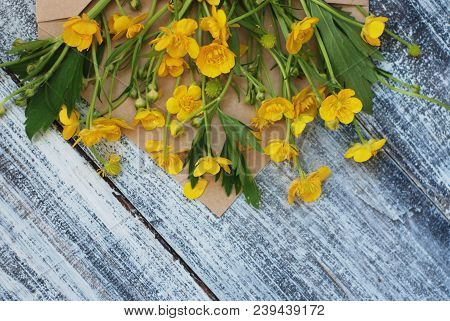 Yellow Little Flowers In Envelope Rustic Wooden Background