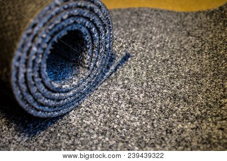 Gray Carpet Roll Is Frozen And Sliced