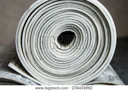 Gray Linoleum Rolled Up, Cut Into Pieces
