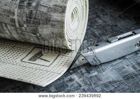 Gray Linoleum Rolled Up, Cut Into Pieces