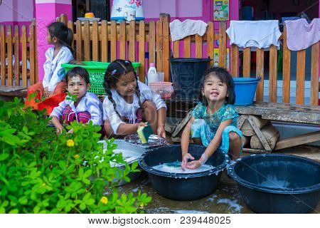 Kanchanaburi, Thailand - September 8, 2016: Kindergarten Kids In Rural Nursery School Washing Dishes
