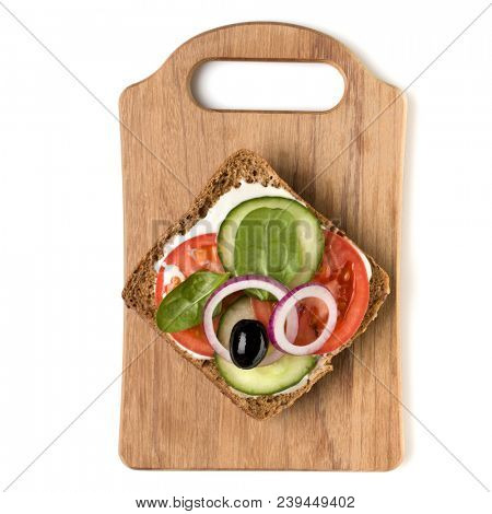 Open  faced vegetable sandwich canape or crostini on a wooden serving board  isolated on white background closeup. Top view.  Vegetarian tartarine.