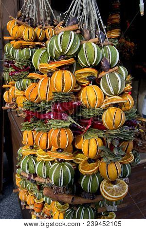 Colorful Xmas Decoretions With Dry Fruits To Hang With Oranges, Lemons And Cinnamoms