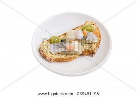 Open Sandwich Made Of Brown Sprouted Bread, Slices Of Fillet Of Pickled Atlantic Herring And Green O