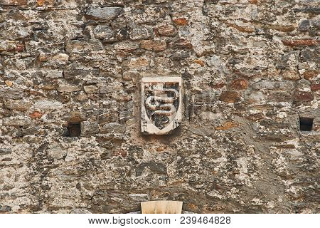 Ancient Coat Of Arms Of Swiss City Of Bellinzona Depicting An Erect Serpent On The Old Town Wall