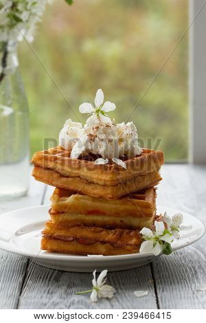 On Saucer In Spring Composition On Wooden Background.spring Still Life With Cherry Blossoms