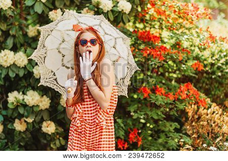 Funny Little Girl Wearing Gingham Playsuit, Heart Shaped Sunglasses, White Gloves, Holding Lace Para