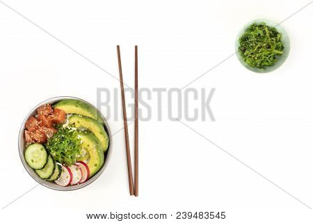 Hawaiian Tuna Poke Salad On White, With Wakame Seaweed Salad, Chopsticks, And Copy Space