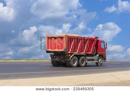 Big Dump Truck Goes On Highway Photo