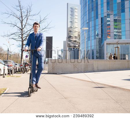 Using Electric Scooter On The Street