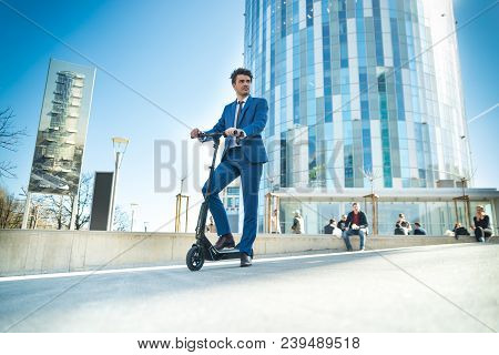 Using Electric Scooter On The Street
