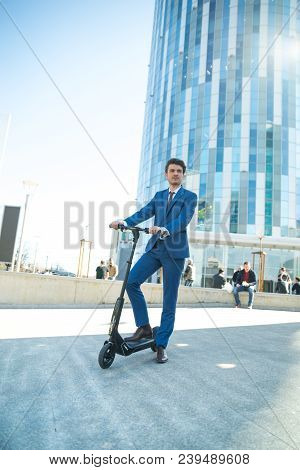 Using Electric Scooter On The Street