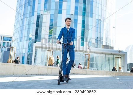 Using Electric Scooter On The Street