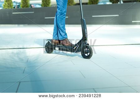 Using Electric Scooter On The Street