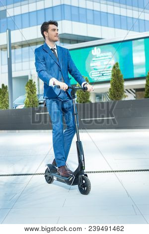 Using Electric Scooter On The Street