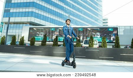 Using Electric Scooter On The Street