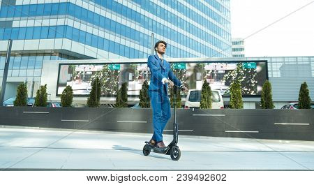 Using Electric Scooter On The Street