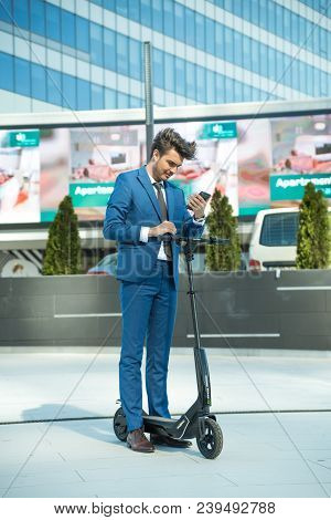 Using Electric Scooter On The Street