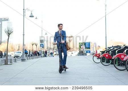 Bucharest, Romania, - Octomber 26, 2017: Using Electric Scooter On The Street On A Sunny Day With Sa