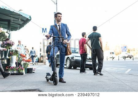 Bucharest, Romania, - Octomber 26, 2017: Using Electric Scooter On The Street On A Sunny Day With Sa