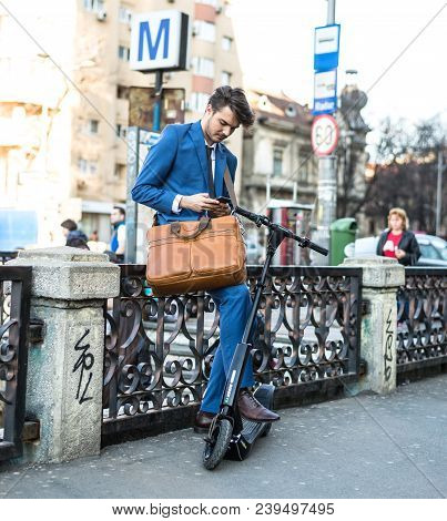 Bucharest, Romania, - Octomber 26, 2017: Using Electric Scooter On The Street On A Sunny Day With Sa